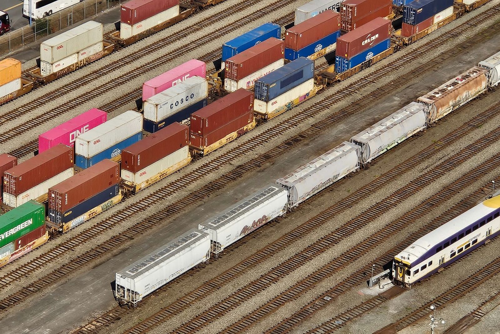 Containers stacked under gantry cranes